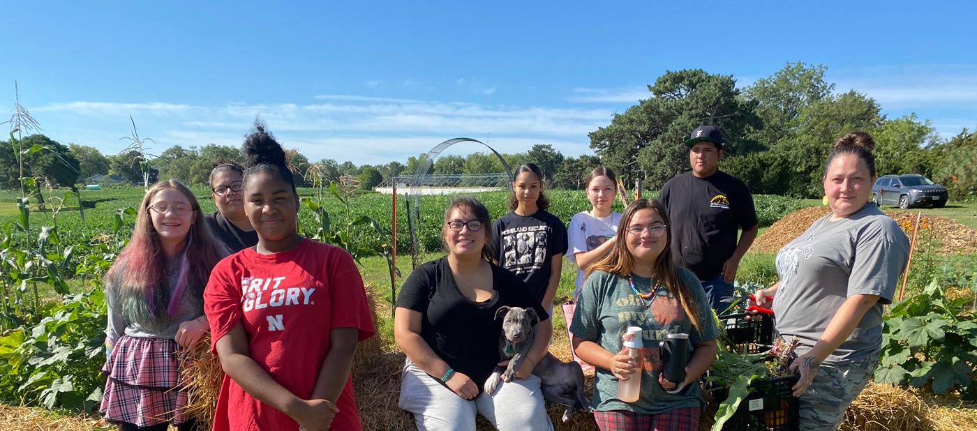 photo of students and their families in the garden at the UNL Indigenous Garden